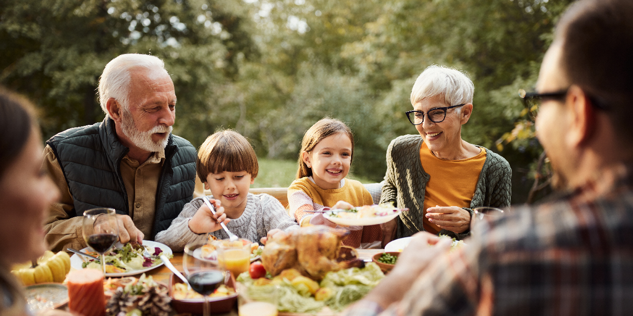 Family eating dinner outside