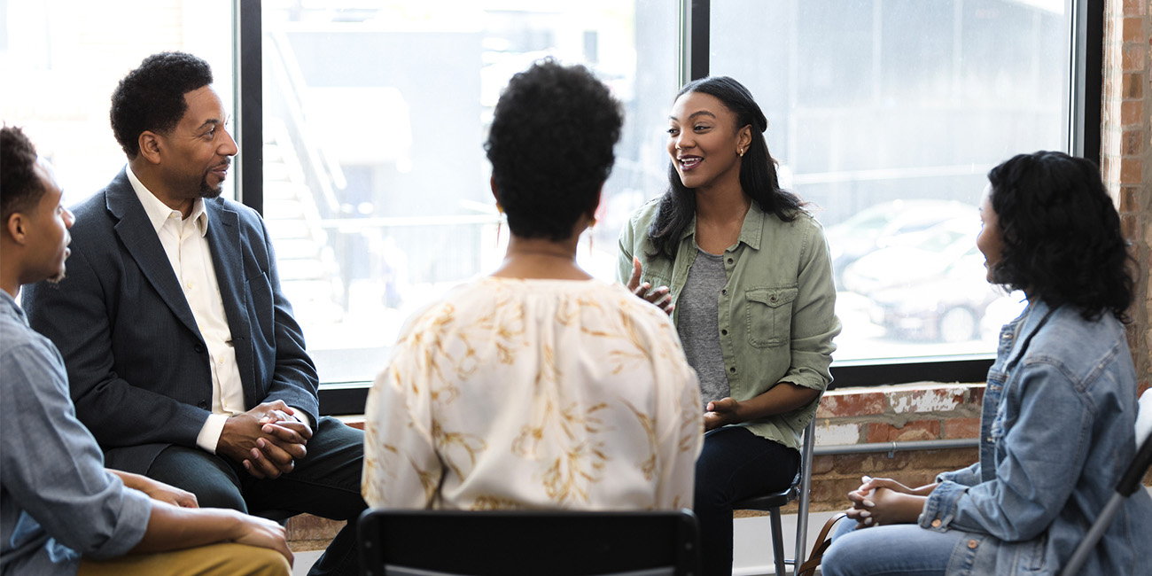 People meeting for group therapy session