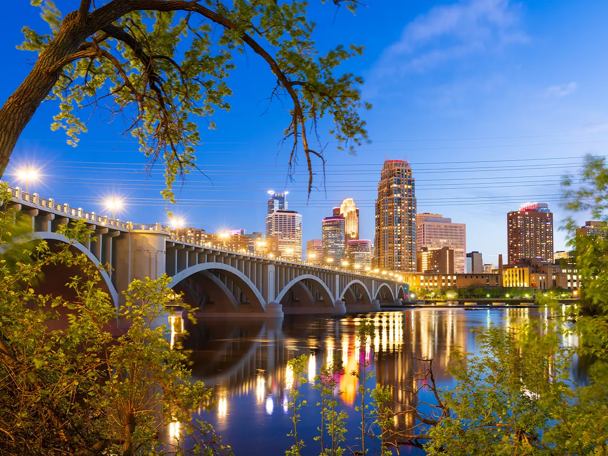 The Minneapolis skyline reflected in the evening on water