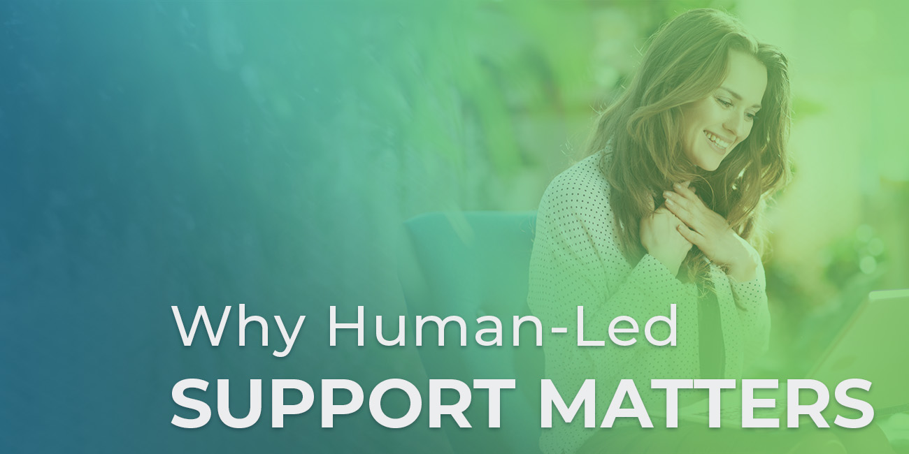 Woman doing a virtual call on her computer. Why Human-Led Support Matters