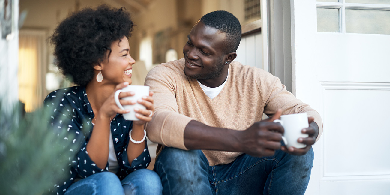 AOH-WellBeing-UnderstandingRelationships Couple outside sitting and drinking coffee