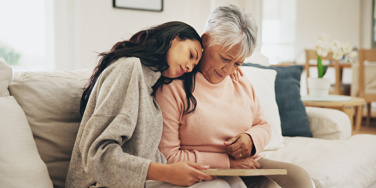 Woman and daughter grieving over losing someone