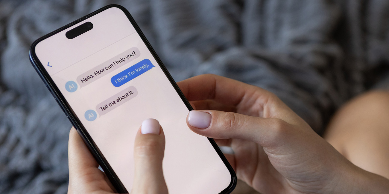 Someone on their phone, texting a AI Therapy bot