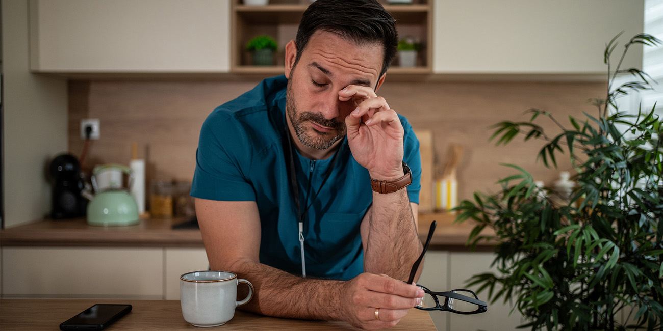 Male nurse looking tired