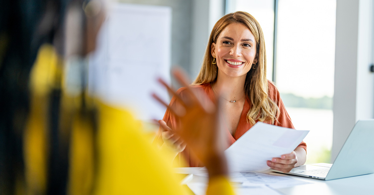 HR professional speaking with employee
