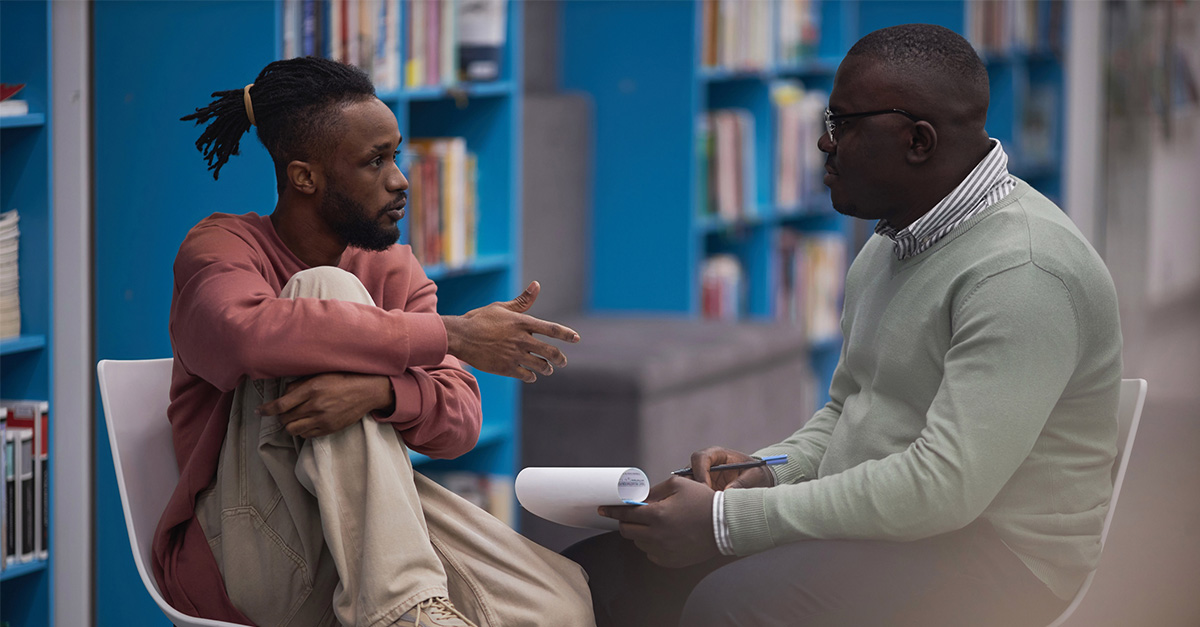 College student speaking to a counselor